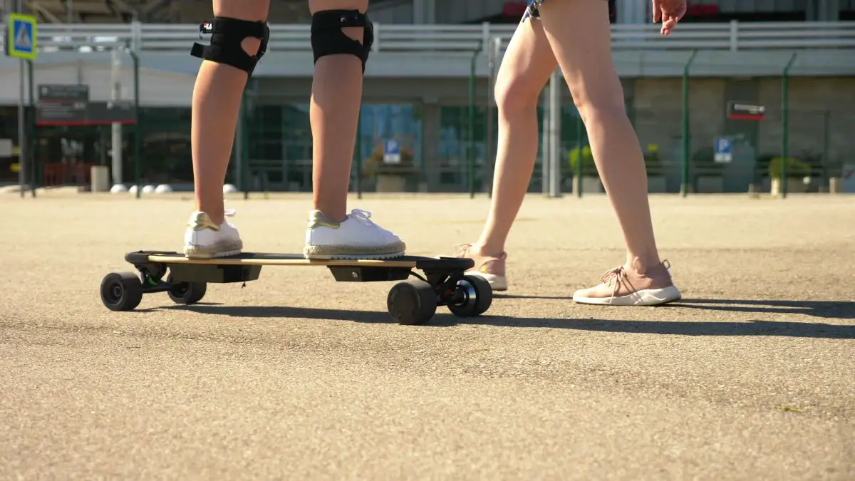 Girls riding electric skateboard