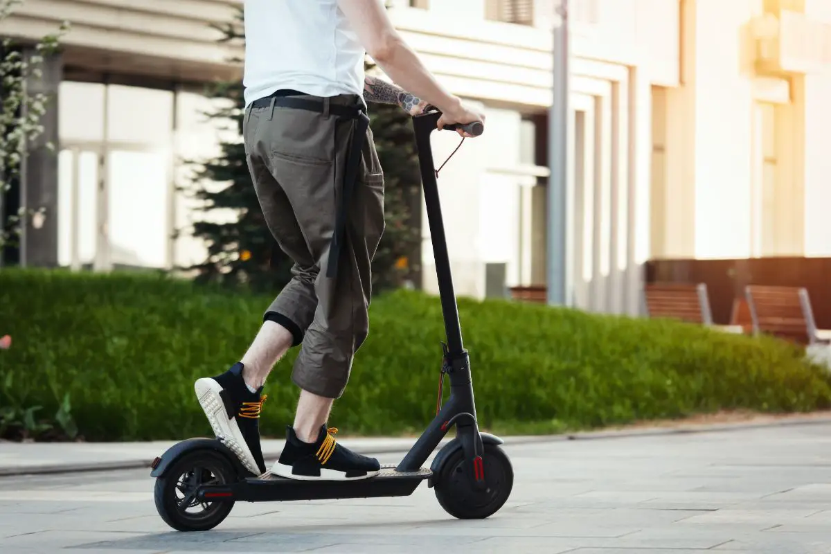 Man riding an electric scooter