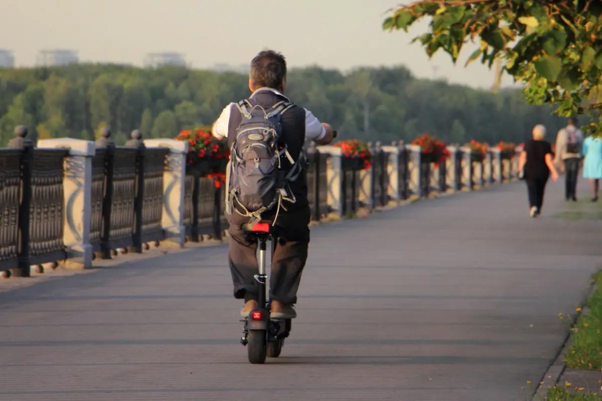 man riding on electric scooter