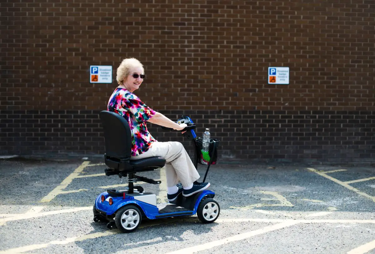 senior woman riding scooter